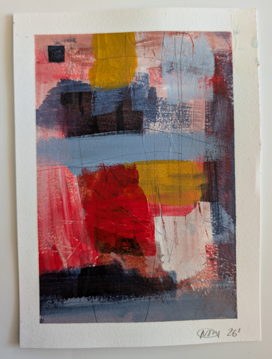An abstract art print on textured paper, featuring a colorful composition of red, yellow, blue, pink, and black brushstrokes with a white border, displayed against a neutral light gray wall.